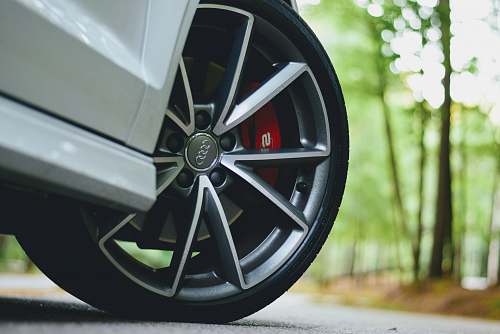 machine white Audi vehicle with gray wheels tire