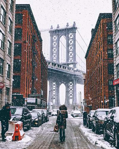 snow woman facing towards Brooklyn Bridge in New York city