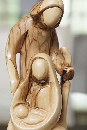 ivory man and woman with baby wooden sculpture figurine