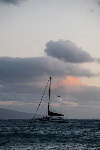 transportation white sailboat bodies of water under cloudy sky at daytime vessel