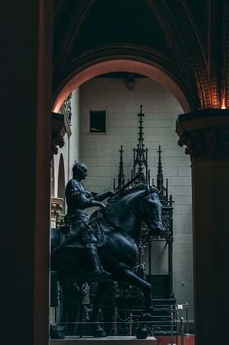 horse knight riding horse statue inside building mammal