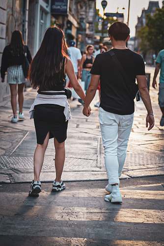 clothing couple walking on pedestrian lane shorts