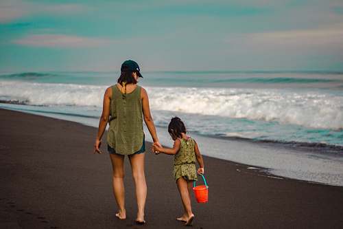 clothing mother and daughter walking near hore shorts