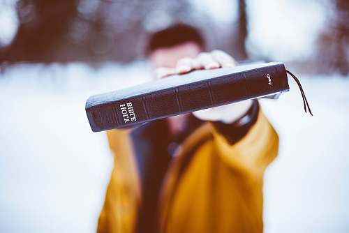 church person holding Holy Bible christian