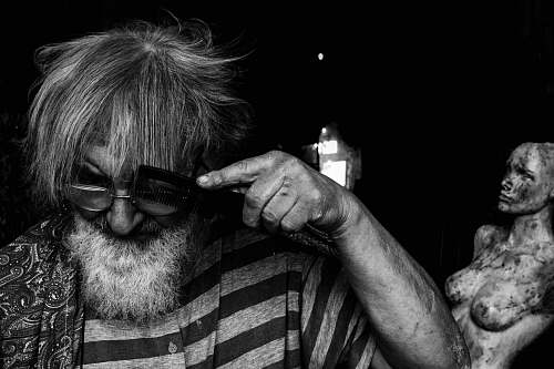 beard man using comb italy