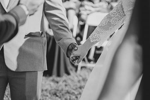 grey wedding couple hold each other's hand hand