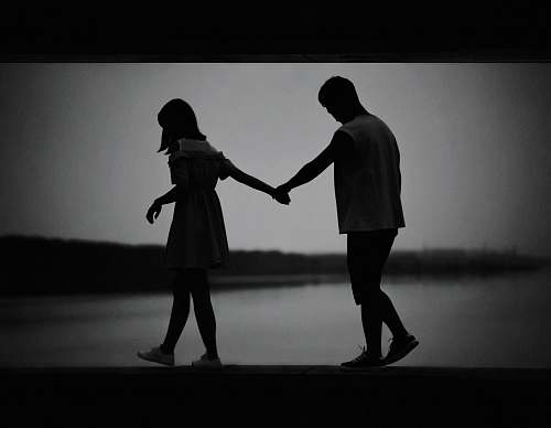 hand woman and man walking while holding hands holding hands