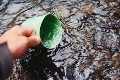 chile focus photo of person scooping water water