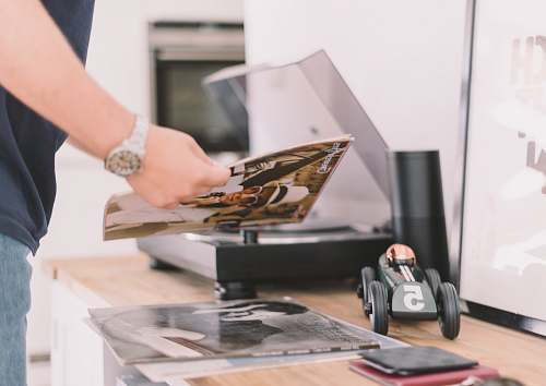 music person holding record sleeve record