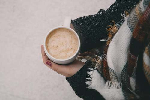 cup person holding white ceramic mug winter