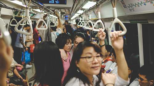 train woman in pink T-shirt standing in train subway