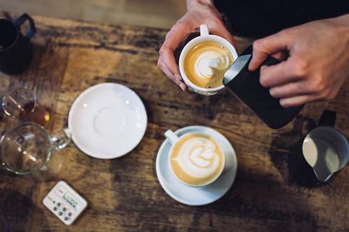 coffee person holding teacup near saucer drink