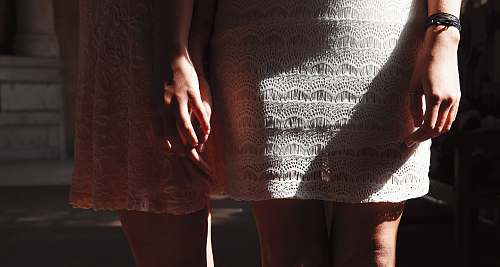 women woman holding other woman hand ankle