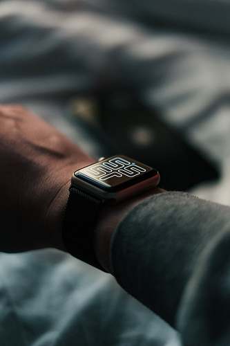 wristwatch smartwatch displaying 22:12 time camera