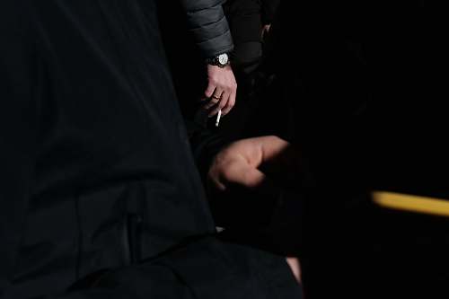 human person holding white cigarette hand