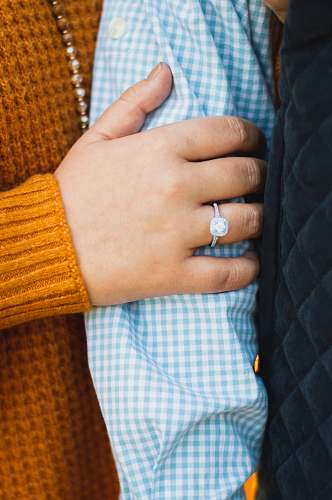 person person in yellow knit sweater with silver ring human