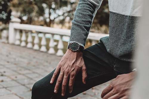 person person wearing black denim jeans wristwatch