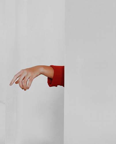 person red long-sleeved top hand