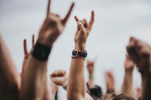 human sign of the horns close up photography person