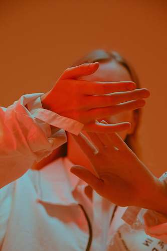 hand woman in white dress shirt red