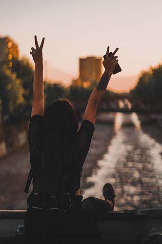 human woman sitting on boat sailing on river person