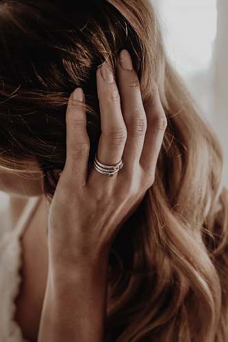 person woman wearing gold-colored ring human