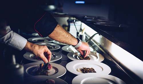 restaurant person preparing cooked dish chef