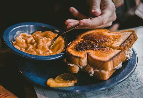 toast plate of toasted bread and bowl of pork and beans bread