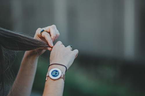 hand woman holding hair wrist