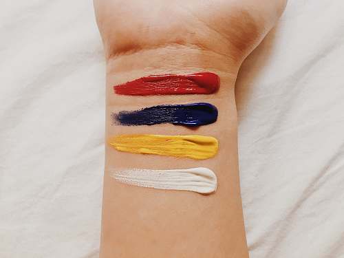 arm four oil paints on wrist wrist