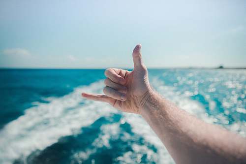 boat gnarly hand sign ocean