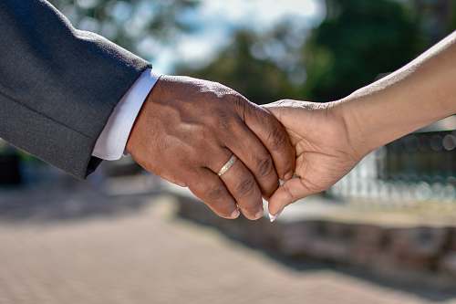 person gold-colored wedding ring human