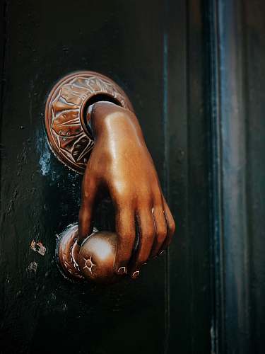 finger gold hand door knob art