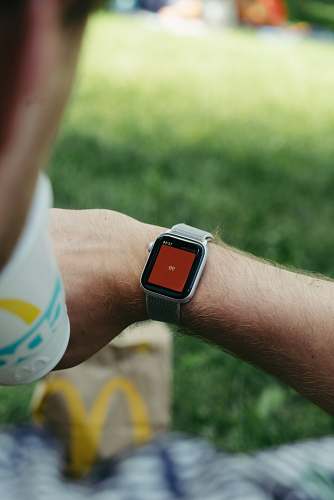 human gray and black smart watch with metal straps wristwatch