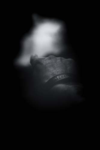 finger grayscale photo of man showing index finger wristwatch