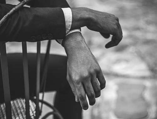 black-and-white grayscale photography of person finger