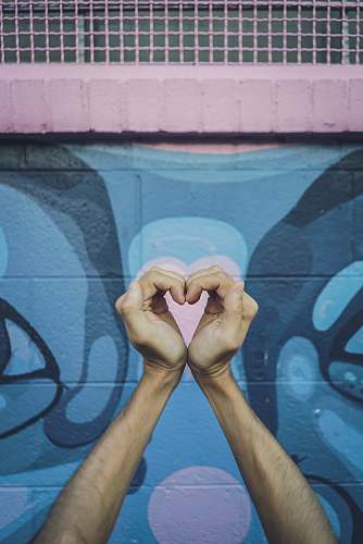 art human hands doing heart gesture painting