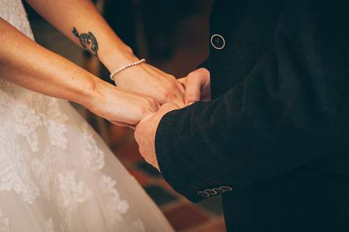 wedding man and woman holding each others hand couple