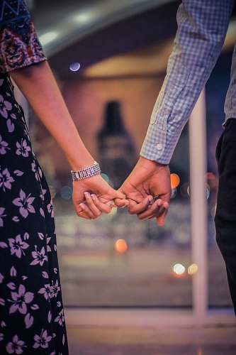 human man and woman holding hands holding hands