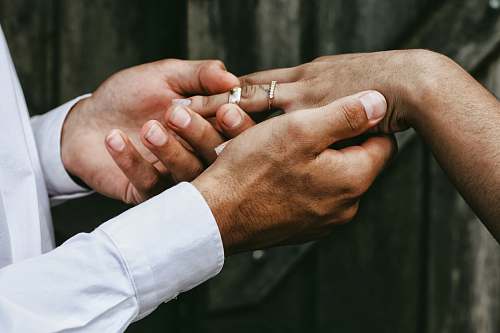 people man holding person's hands wedding