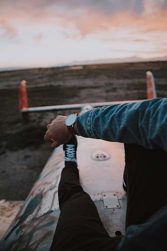 human man sitting on metal platform person
