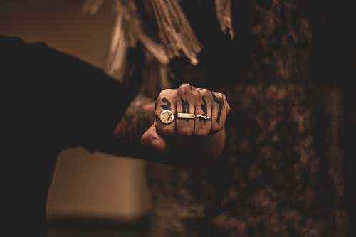 human man wearing three rings finger