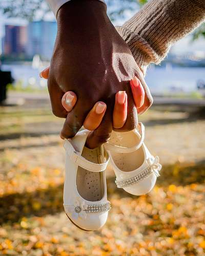 person pair of white Mary Jane shoes human