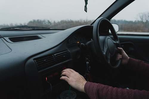 driving person driving black car vehicle