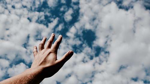 clouds person hand reaching for the sky worship