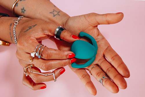 human person holding blue toy person
