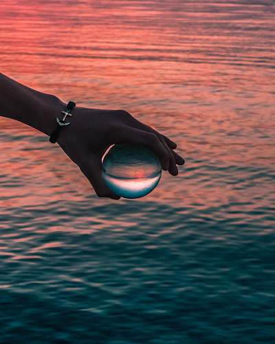 water person holding clear ball apparel
