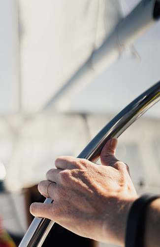 wheel person holding gray metal tube steer