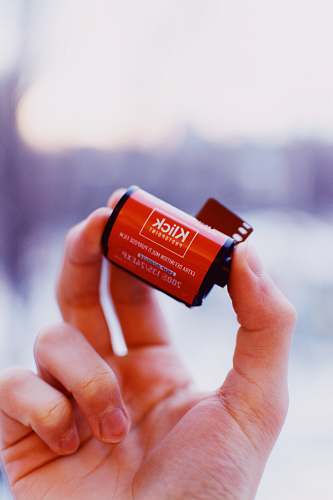 human person holding Klick camera film person