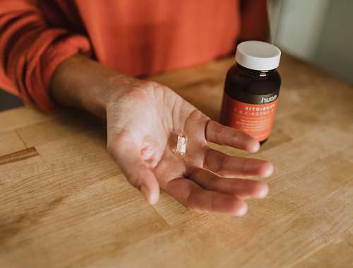 human person holding medication pill person